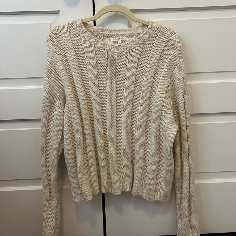 Packing knit sweater in cream